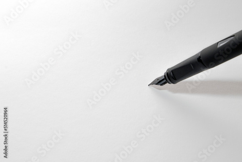 fountain pen writing on a blank white paper