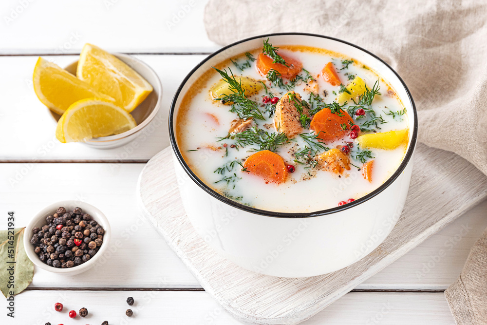 Lohikeitto, Finnish creamy salmon soup in a white bowl Lohikeitto, Finnish creamy salmon soup in a white bowl