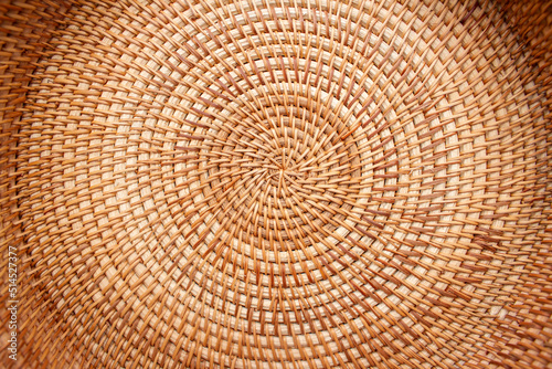 Close up detail view of a wicker basket weave with natural materials