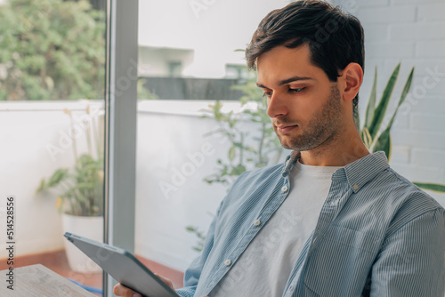 young man with digital tablet or ebook at home