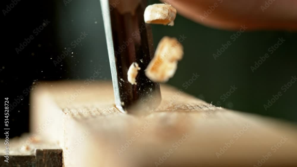 Super slow motion of detail of carving wood with a chisel. Low depth of focus, super macro shot. Filmed on high speed cinema camera, 1000 fps.