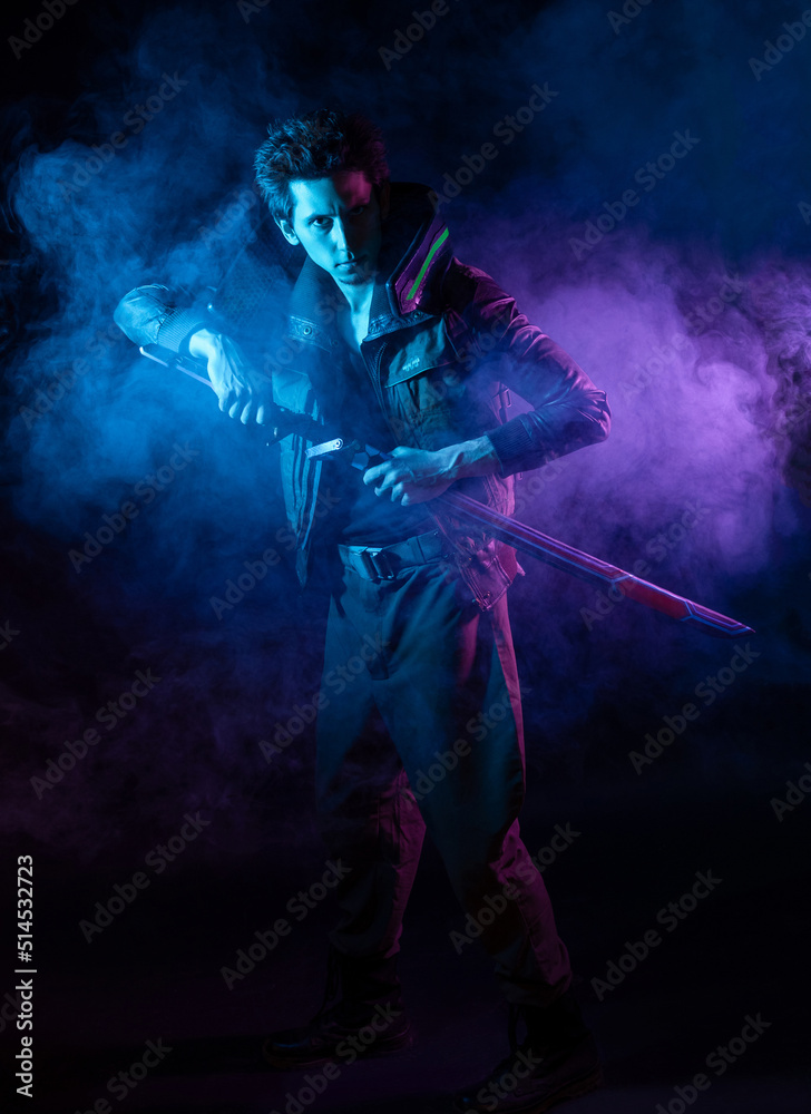 A guy in a cyberpunk image, holding a tuned sword in his hands. Cyborg samurai. A young man in neon lighting on a black background