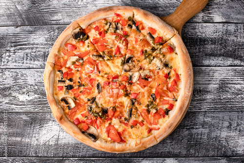 Pizza, hot pizza on a white wooden background, side and top view