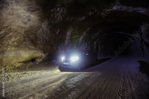 Car inside old underground road tunnel inside mountain