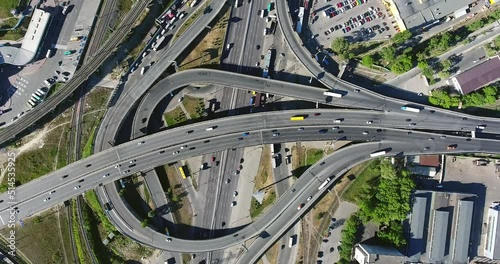 Circling view from copter moving down. The Kyiv transport interchange full of driving cars. photo