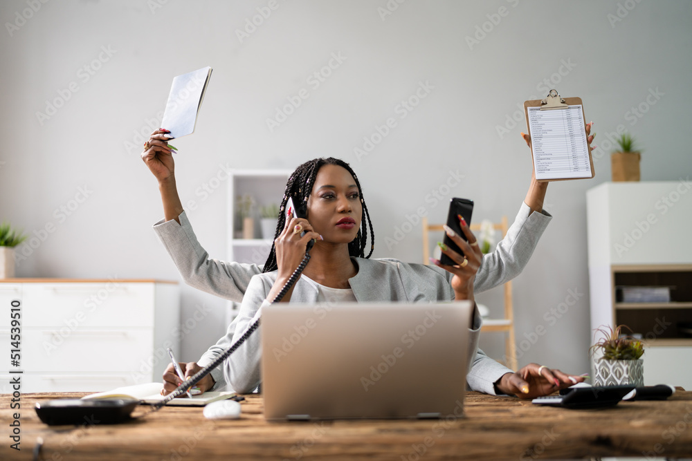 © Andrey Popov - Multitasking Businesswoman In Office © Andrey Popov - Multitasking Businesswoman In Office