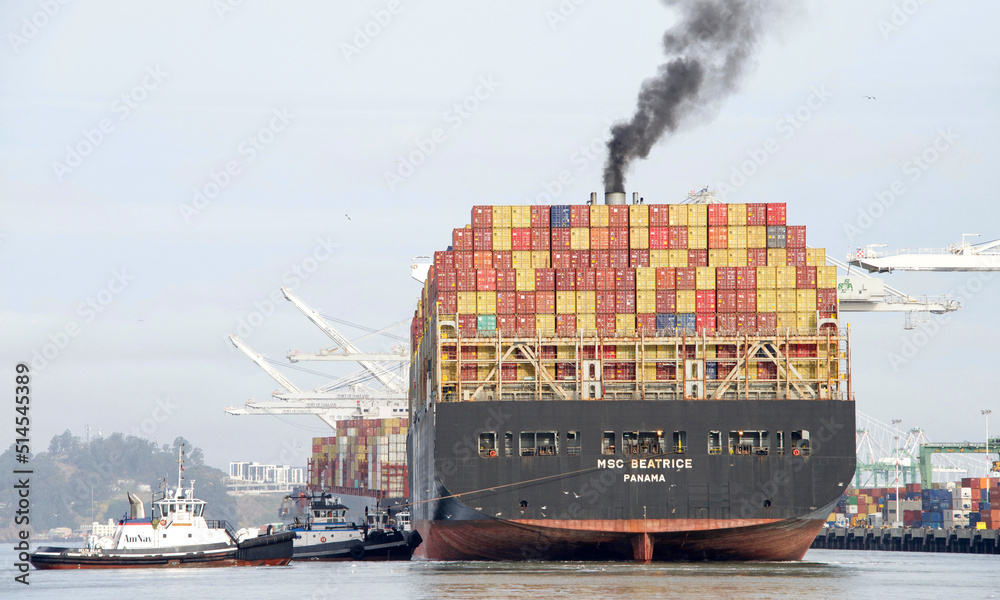 Oakland, CA May 5, 2022 Multiple tugboats assisting cargo ship MSC