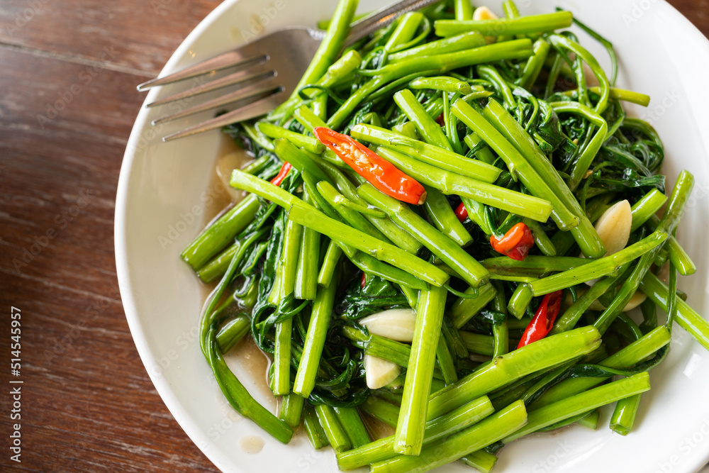 Fried morning glory light .Thai food. Pad pak boong is Thai traditional Fried morning glory light .Thai food. Pad pak boong is Thai traditional