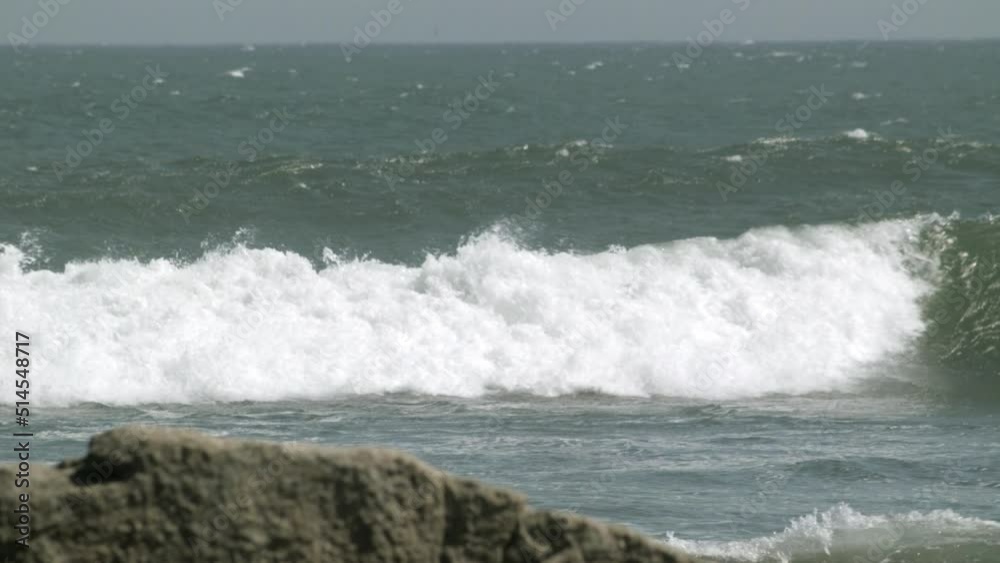 Surfer Paddling Out Through Surf and Waves to Sea on Surfboard, Static Surfer Paddling Out Through Surf and Waves to Sea on Surfboard, Static