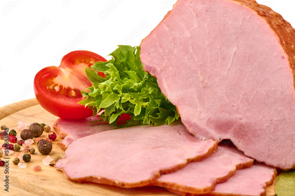 Smoked pork loin on a cutting board with condiments Smoked pork loin on a cutting board with condiments