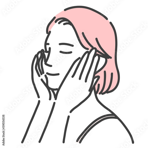 顔に手を当ててスキンケアをしている若い女性
