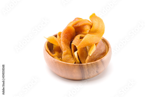 Dried mango in woodle bowl isolated on white background. copy space photo