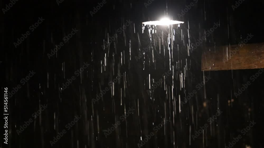 down light lamp enlightened in heavy rain at night 