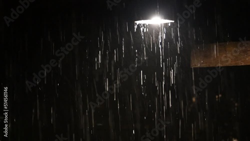 down light lamp enlightened in heavy rain at night 