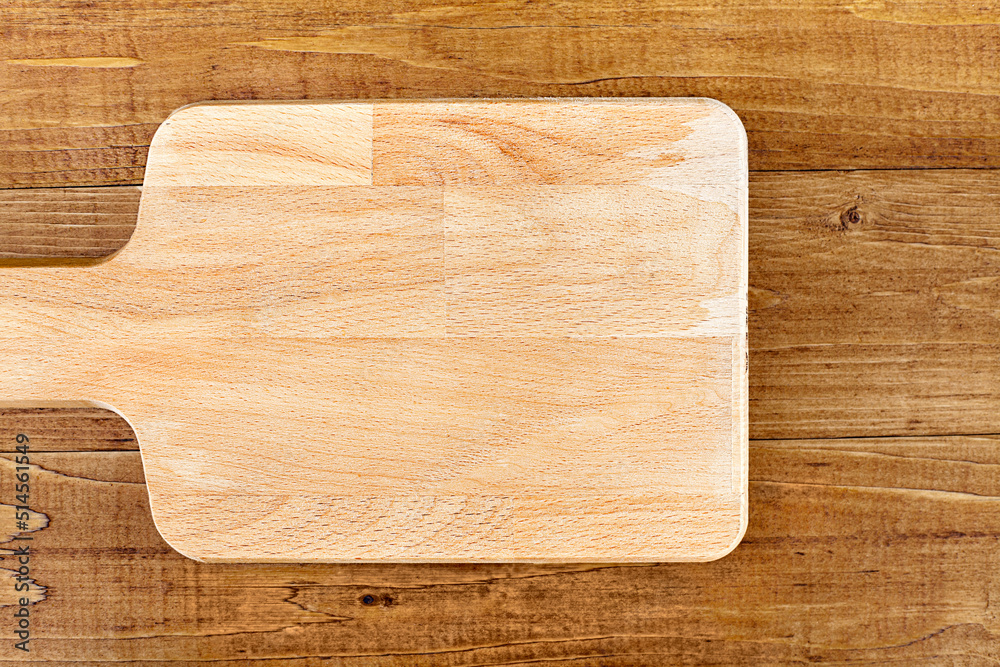 cutting board close-up on a wooden table. View from above cutting board close-up on a wooden table. View from above