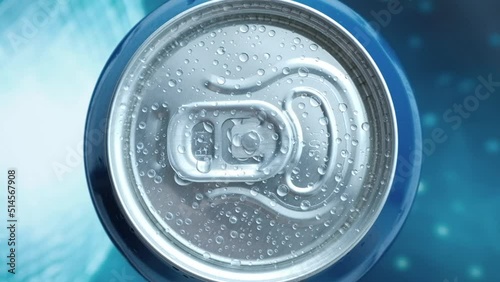 a man's hand takes a cold beer or a can of soda with drops of water. Drink drinks in aluminum cans with a latch. View from above. blue iridescent screen background