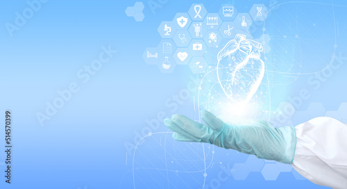 Doctor examines the Heart hologram while reviewing the test results on the virtual interface and performing data analysis. Future medicine, cutting-edge technologies. Medical technology and healthcare