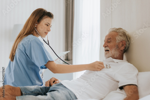 Asian nurse caring elderly man at home. young nurse helping senior man at home. Senior health care.