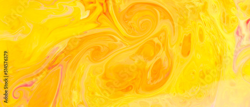 Fluid Art. Abstract golden orange backdrop. Yellow and orange paint pigment background
