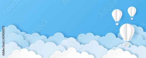 Canvastavla Paper art style of clouds with hot air balloons on blue sky background