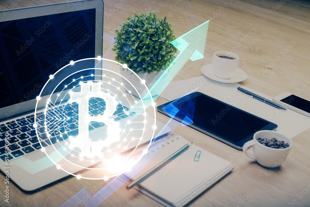 Double exposure of blockchain and crypto economy theme hologram and table with computer background. Concept of bitcoin cryptocurrency. Double exposure of blockchain and crypto economy theme hologram and table with computer background. Concept of bitcoin cryptocurrency.