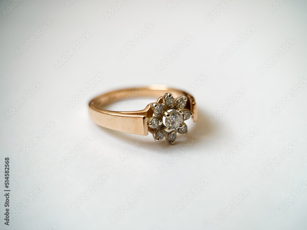 Gold diamond ring on a white isolated background. Red Gold Ring Gold diamond ring on a white isolated background. Red Gold Ring