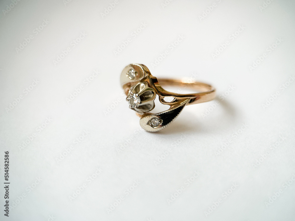 Gold diamond ring on a white isolated background. Red Gold Ring Gold diamond ring on a white isolated background. Red Gold Ring