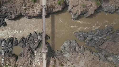Bridge over the stormy Katun River in the Altai Mountains