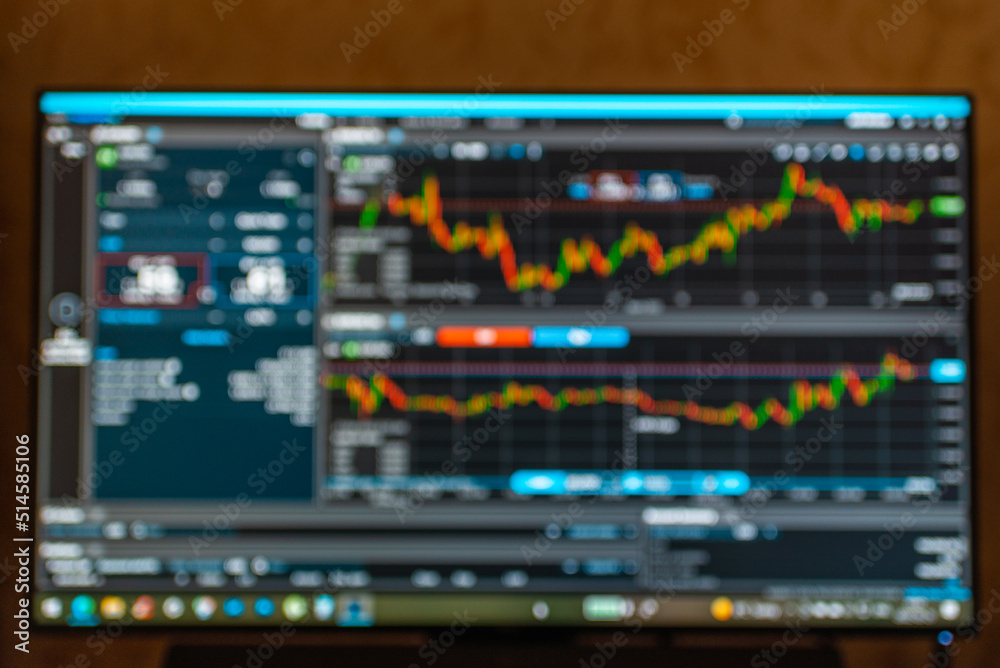 Stock market data.Online trading,investing platform on the computer screen.blurred background.