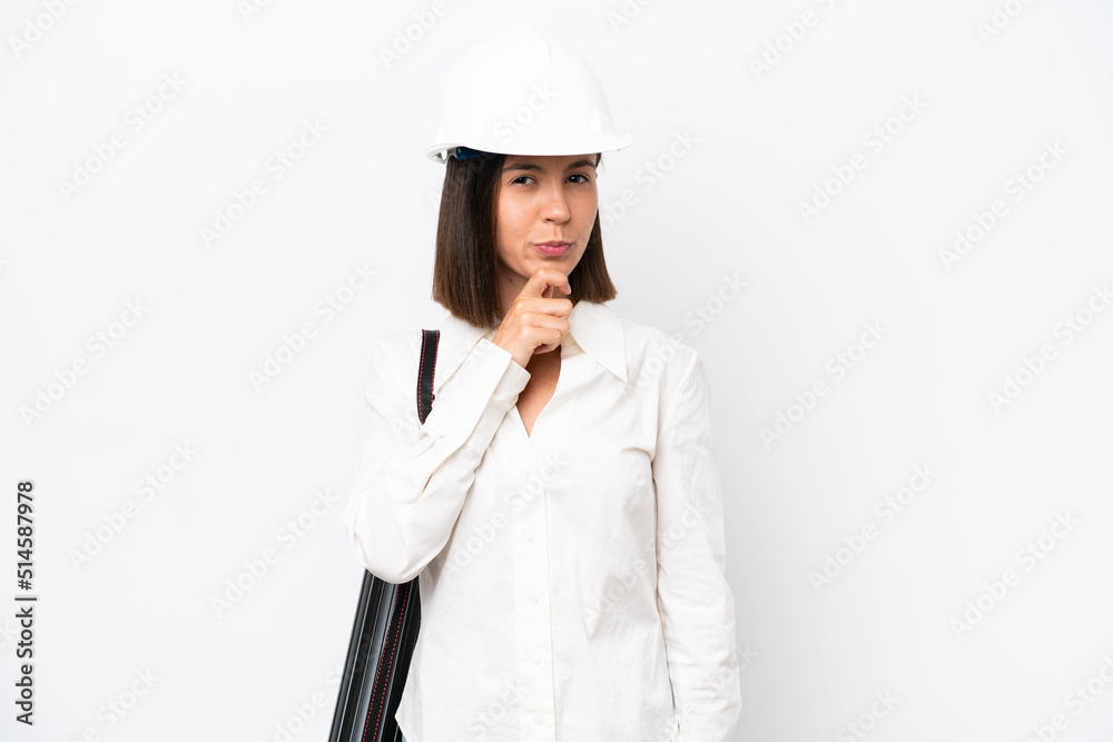 Young architect woman with helmet and holding blueprints isolated on white background thinking Young architect woman with helmet and holding blueprints isolated on white background thinking