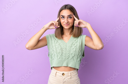 Young caucasian woman isolated on purple background having doubts and thinking