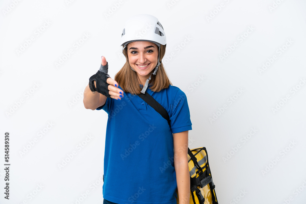 Young caucasian woman with thermal backpack isolated on white background shaking hands for closing a good deal Young caucasian woman with thermal backpack isolated on white background shaking hands for closing a good deal