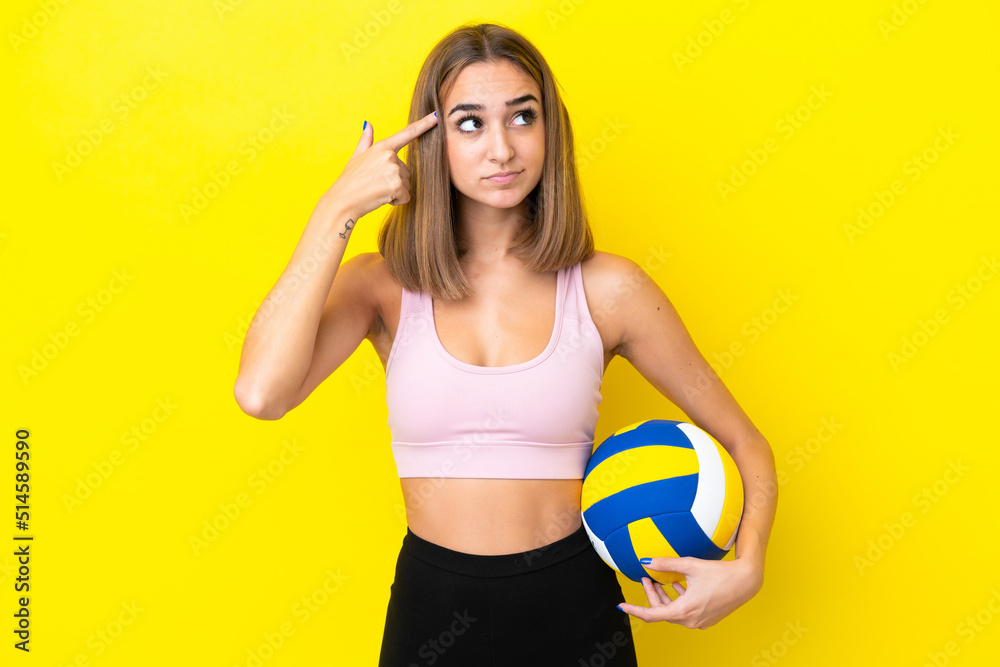 Young woman playing volleyball isolated on yellow background having doubts and thinking Young woman playing volleyball isolated on yellow background having doubts and thinking