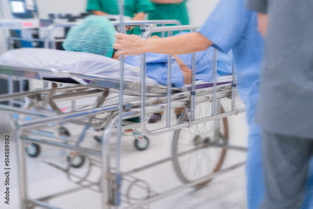 Motion blur of staff rushing patient to emergency room at hospital Motion blur of staff rushing patient to emergency room at hospital