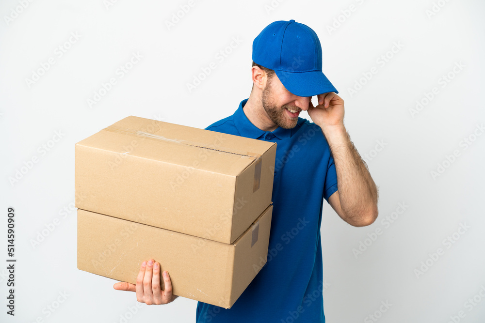 Delivery man over isolated white background laughing Delivery man over isolated white background laughing