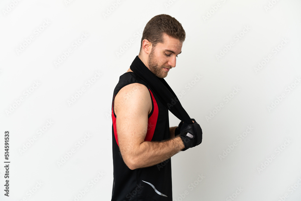 Handsome blonde man over isolated white background with sport towel Handsome blonde man over isolated white background with sport towel