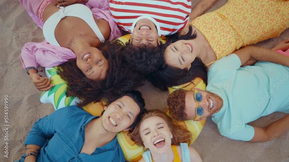 roup of friends having fun on the beach. Multiethnic Teenagers having a good time during the summer celebrating together next to the ocean. roup of friends having fun on the beach. Multiethnic Teenagers having a good time during the summer celebrating together next to the ocean.