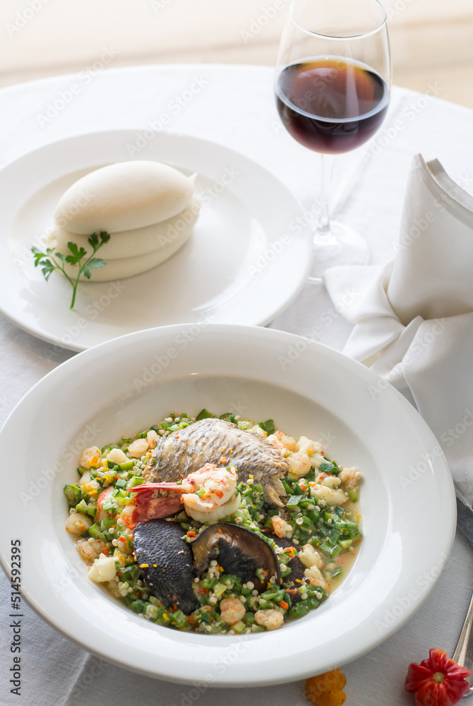 Nigerian seafood okra or okro soup served with pounded yam or fufu and red wine Nigerian seafood okra or okro soup served with pounded yam or fufu and red wine