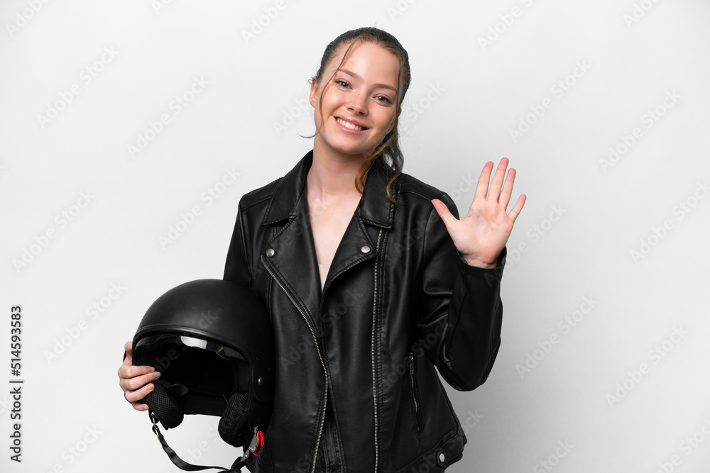 Young caucasian girl with a motorcycle helmet isolated on white background counting five with fingers
