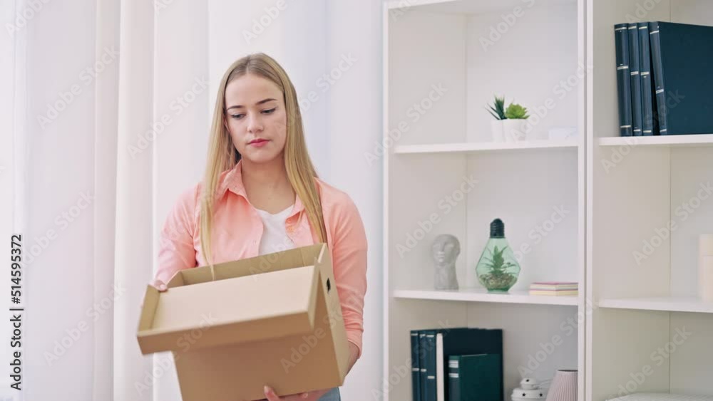 Young woman sadly packing things, moving out of partner's home, break-up