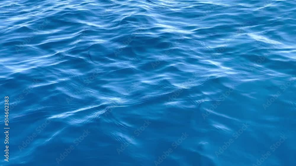 High angle close up sea water surface. High quality 4k footage calm waves blue color ripples High angle close up sea water surface. High quality 4k footage calm waves blue color ripples