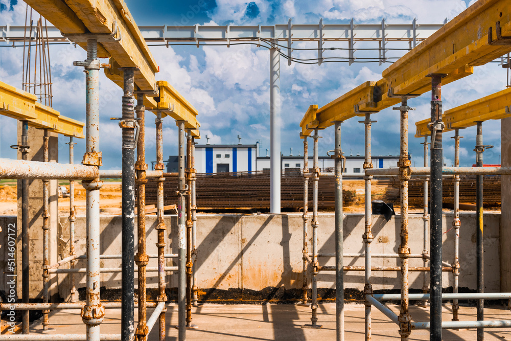 Formwork for pouring the second floor of a monolithic building. Reinforcement of walls and ceiling. Monolithic work during the construction of a building close-up. Construction technologies. Formwork for pouring the second floor of a monolithic building. Reinforcement of walls and ceiling. Monolithic work during the construction of a building close-up. Construction technologies.