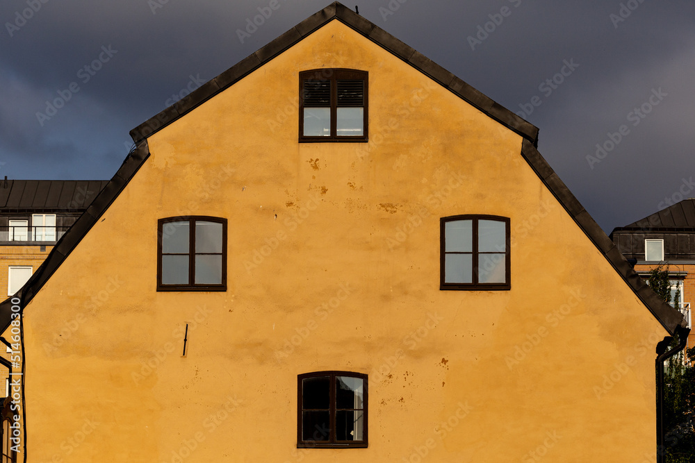 Stockholm, Sweden An old yellow house facade and windows on Graverska Huset on Kungsholmen. Stockholm, Sweden An old yellow house facade and windows on Graverska Huset on Kungsholmen.
