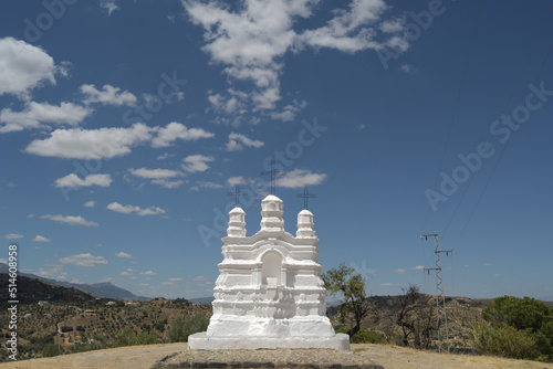 Religious monument a sunny day with clouds in the blue sky, Monda, Spain