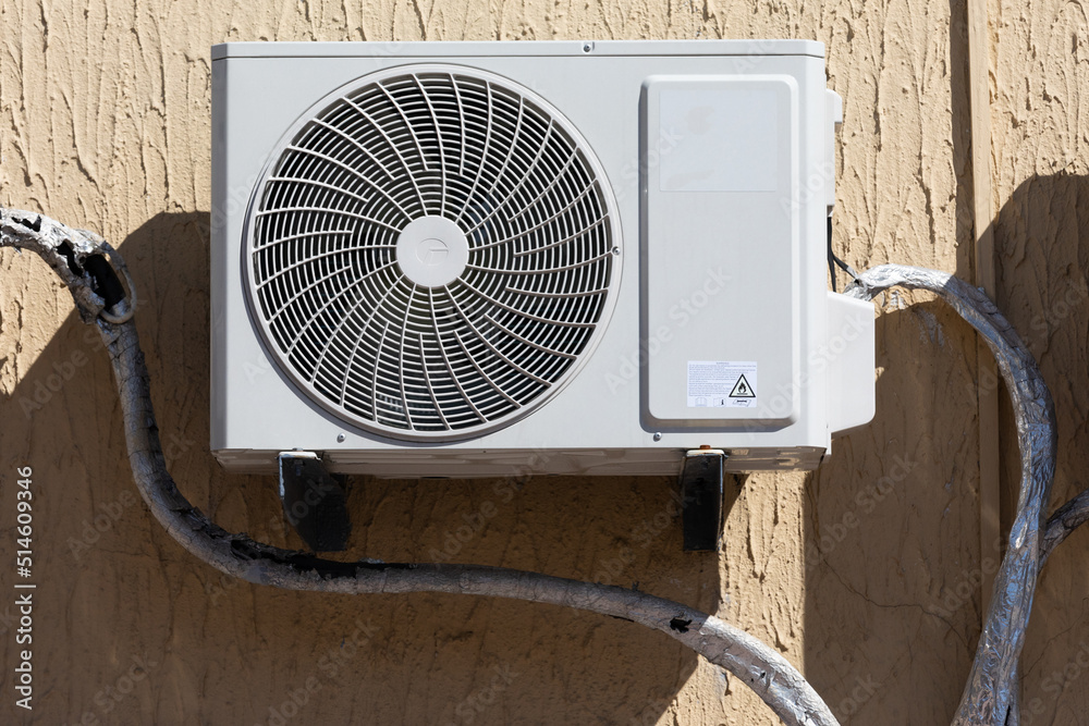 block of climatic equipment of the air conditioner hanging outside the building block of climatic equipment of the air conditioner hanging outside the building