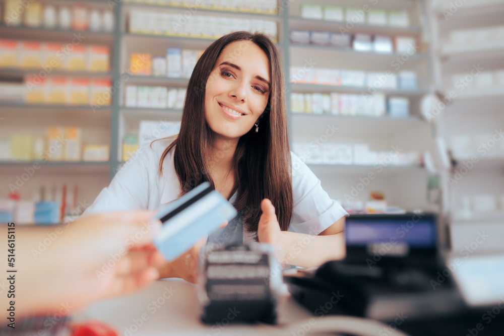 Fototapeta premium Customer Paying with Credit Card in a Pharmacy Drugstore - Person using contactless payment method in a store 