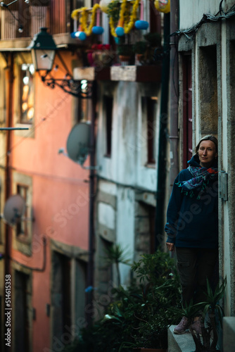 A woman at the door of a house in the old town. Porto, Portugal. © De Visu