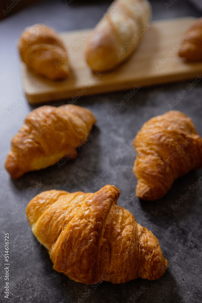 Homemade croissants on old table background.