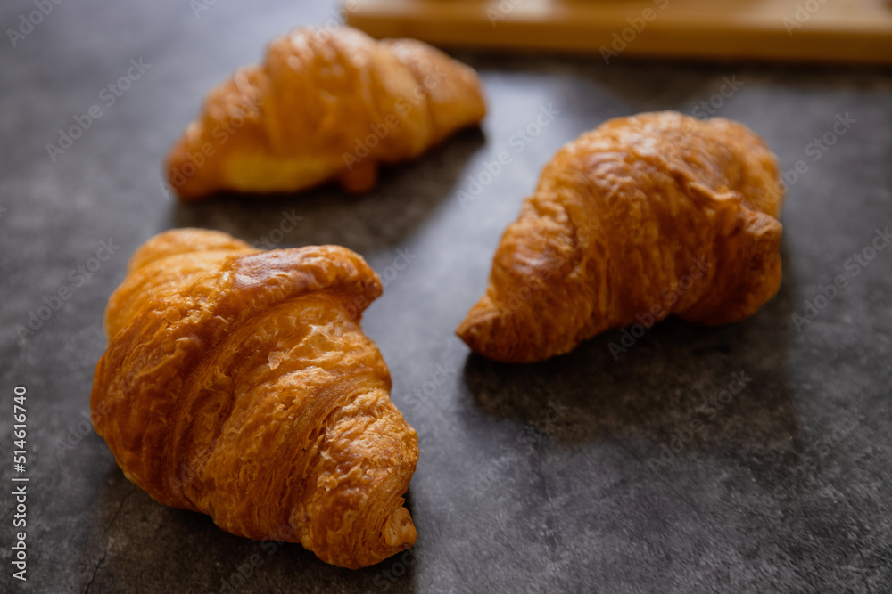 Homemade croissants on old table background. Homemade croissants on old table background.