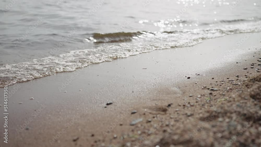 Slow motion closeup shot of waves rolling on a beach on Baltic Sea Slow motion closeup shot of waves rolling on a beach on Baltic Sea